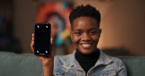 Mobile app developer or software engineerAfrican woman in the living room Stock Footage 245180318