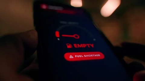 Mobile app fuel gauge changing from normal to empty with fuel shortage warning. Stock Footage 343238535