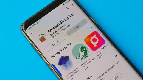 Mobile application Amazon store installation on a smartphone. Amazon logo on the Stock Footage 208898815