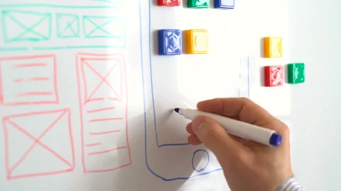 The mobile application designer is working on the interface of the modern Stock Footage 86564953