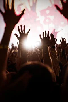 Mobile background vertical crowd hands reaching for stage light Stock Photos