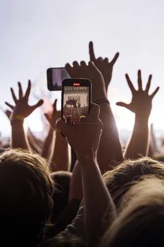 Mobile background vertical shot of crowd hands at concert Stock Photos