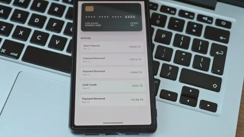 Mobile banking application on smartphone screen showing financial transaction Stock Footage 337998228