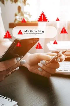 Mobile banking scam call alert message received on smartphone in home office Stock Photos
