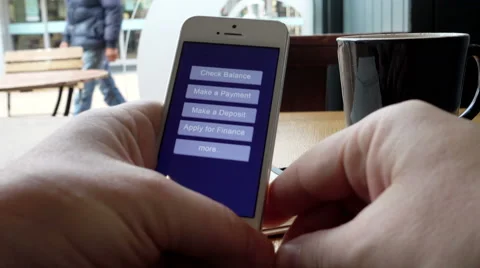 Mobile banking on smartphone in cafe, screen content is released Stock Footage 55710113