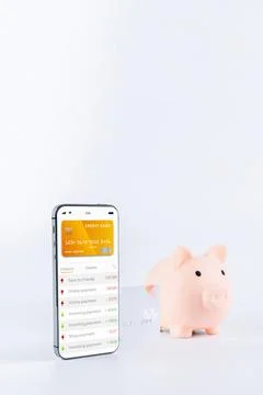 Mobile banking. Smartphone with internet online bank application. Piggy bank  Stock Photos