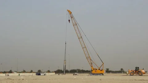 Mobile caterpillar crane slowly move, steel pipe sway at long jib Stock Footage 60129691