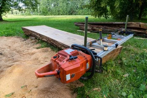 Mobile chainsaw mill with which to cut oak logs on wide boards Stock Photos