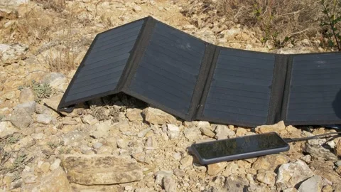 Mobile charging by Solar Panel. Hand disconnect the Cable from the mobile pho Stock Footage 145980675