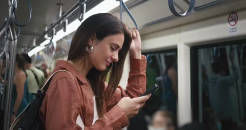 Mobile communication. Side view woman uses her smartphone typing message on Stock Footage 251352840