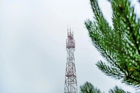 Mobile communication tower on the background of cloud of heaven and nature, t Fotos de archivo