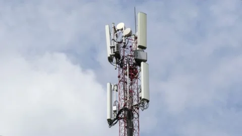 Mobile communication tower on the background of a cloudy sky. Stock Footage 131165148