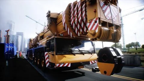 Mobile construction crane. Construction of a large industrial building or Ilustración de archivo