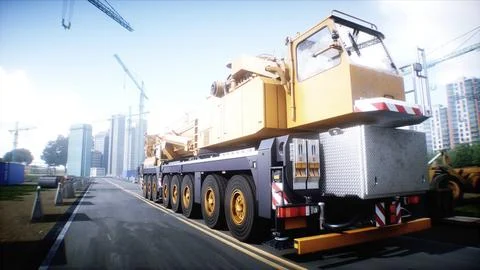 Mobile construction crane. Construction of a large industrial building or Ilustración de archivo
