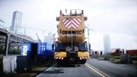 Mobile construction crane. Construction of a large industrial building or Ilustración de archivo