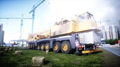 Mobile construction crane. Construction of a large industrial building or Ilustración de archivo