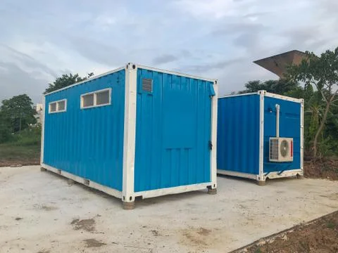 Mobile containers box at construction site Stock Photos