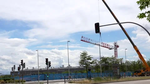 Mobile crane assembling tower crane in Valdebebas Madrid Stock-Footage 334736690