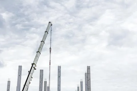 Mobile crane is assembly skeleton of huge hall Stock Photos
