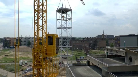 Mobile Crane Lifting Elevator Shaft Over High Building Video stock 102227188