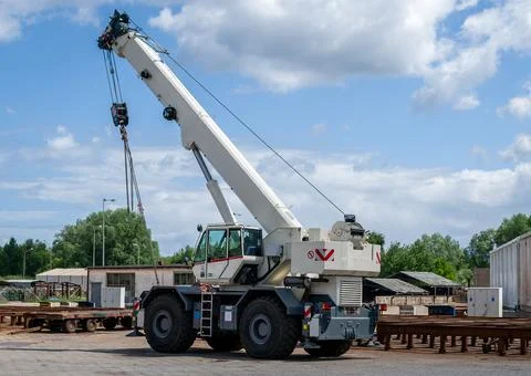 Mobile Crane Lifting a Load at a Construction Site Stock Photos