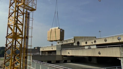 Mobile Crane Lifting Materials Over A High Building Stock Footage 102226850