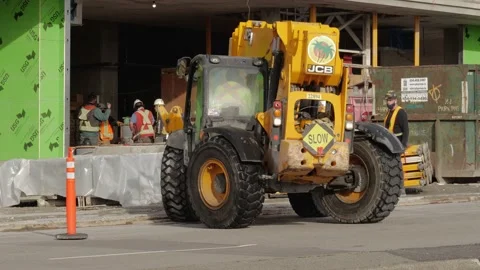 Mobile crane moving on a street in construction area. 库存影片 147994760