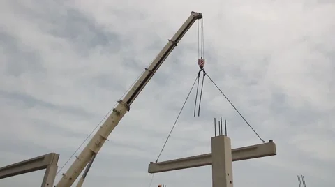 Mobile crane is operating and lifting concrete joist. Vídeos de archivo 59836612