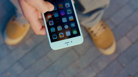 Mobile crashes on the road. Smartphone falls to the sidewalk. Stock Footage 166921655