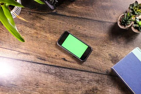 Mobile device on desk Stock Photos