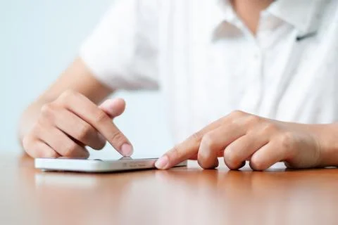 Mobile device interaction home office digital engagement indoor setting clo.. Stock Photos