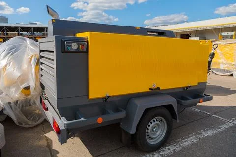 Mobile diesel compressor on wheels for supplying pneumatic air to devices Stock Photos