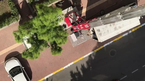 Mobile elevator for transporting household items on the upper floors. A man puts Stock Footage 253737896