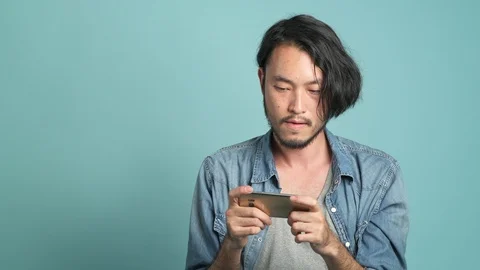 Mobile gaming, concentrated play. Stock Footage 94140406