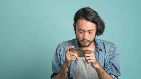 Mobile gaming, concentrated play. Stock Footage 94140419
