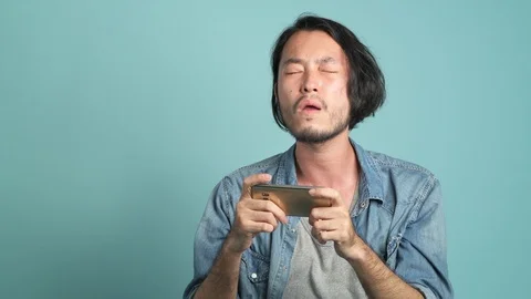 Mobile gaming, concentrated play. Stock Footage 94140430
