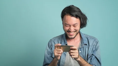 Mobile gaming, concentrated play. Stock Footage 94140434