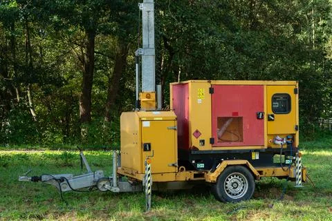 Mobile generator on a construction site in a forested area Stock Photos