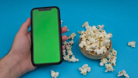 Mobile green screen and popcorn Video stock 260162436