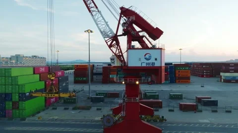 Mobile harbor crane and suspended container spreader at Guangzhou Port Stock Footage 346445857
