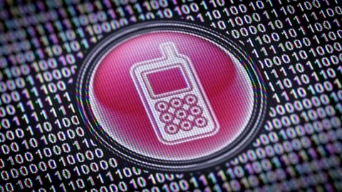 Mobile icon. Binary code ( array of bits ) in the screen. Looping footage 動画素材 110727813