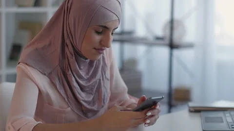 Mobile internet sms texting phone woman home desk Stock Footage 194630628