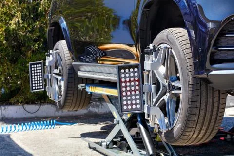 Mobile machine for adjusting camber and wheel alignment. Stock Photos