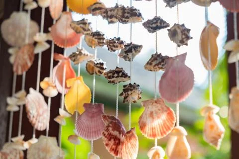 Mobile made from shells Hanging on the window Eye-catching colors When the wi Stock Photos