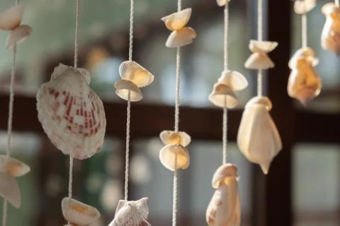 Mobile made from shells Hanging on the window Eye-catching colors When the wi Stock Photos