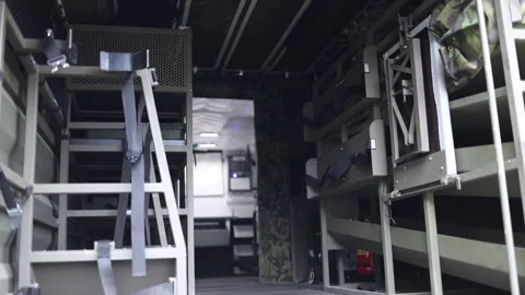 Mobile military interior with secured bunks seatbelts and storage compartments i Stock Footage 311662019