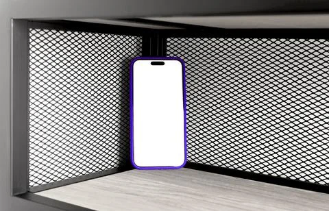Mobile mockup with a blank white screen stands in the corner of a black wir.. Foto stock