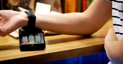 Mobile NFC payment technology POS terminal consumer business transaction paying Video stock 336585626