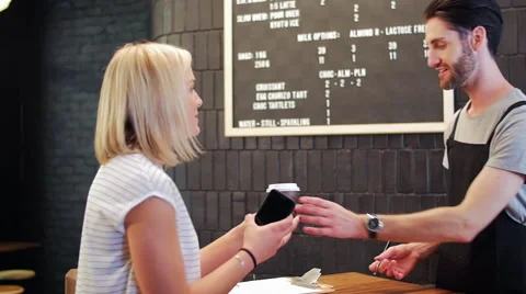 Mobile payment in busy cafe Video stock 58126832