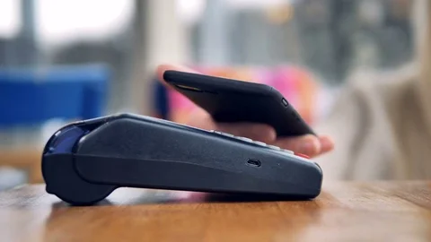 Mobile payment concept. Person making wireless payment with phone. Stock Footage